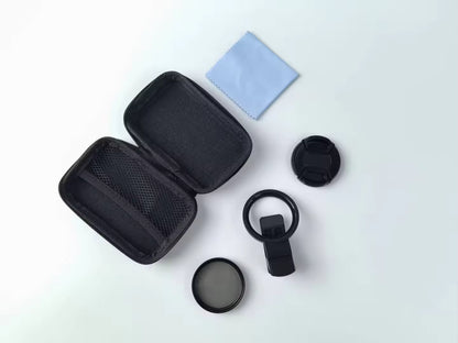 Camera lens cleaning kit with case, lens cap, and cleaning cloth on a white background